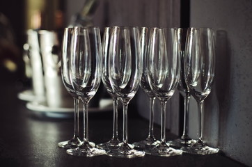  empty wine glasses on table. flutes glasses