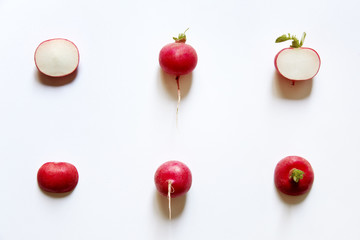 Radishes sliced viewed from above. Flat lay white background, studio.