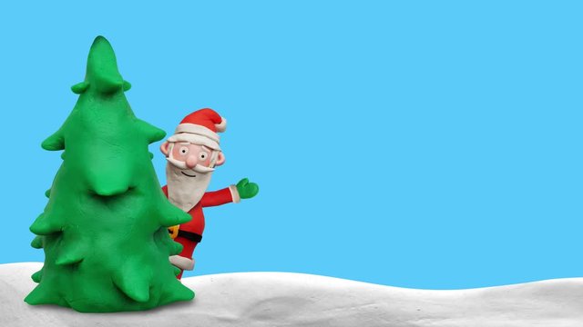 Winkender Weihnachtsmann hinter Baum  – Animation