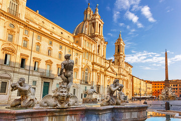 Fototapeta na wymiar View on Piazza Navona with the Moor Fountain and Sant'Agnese in Agone Church