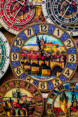 Vibrant multi colored wooden clock. Paint about Prague inside of Clock. One,Two,Three,Four,Five,Six,Seven,Eight,Nine,Ten.