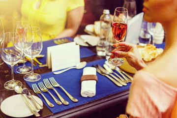 Young women drinking wine in restaurant