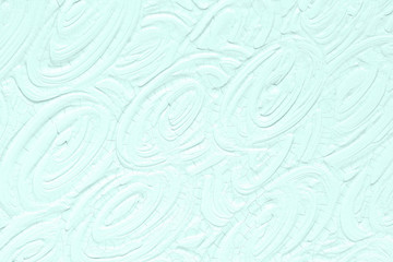 The texture of the paint is blue. Background with a picture of leaves and flowers.