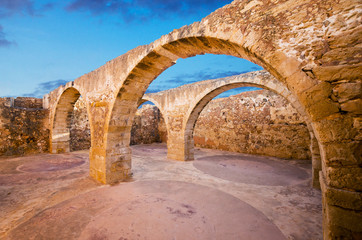 Rethymno town in Crete island, Greece. Old arched vault of Fortezza fortress.