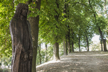 Chelm, Poland, 10 September 2018: Calvary around the Basilica of the Blessed Virgin Mary in Chelm, sculpture by Jacek Kiciński - station I, Jesus condemned to death.