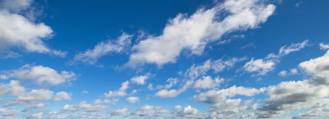 Naklejka na ściany i meble Beautiful panorama of blue sky with white clouds