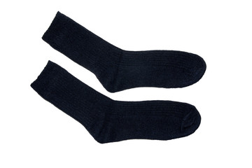 A pair of warm woolen socks on a white background. Isolated