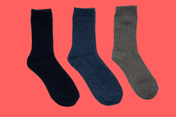 Three socks on red background