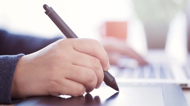 Female artist working with a graphic tablet