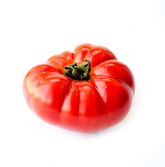Red ripe tomato on white background