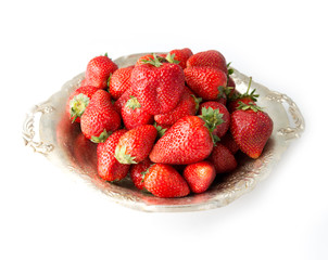strawberries in a bowl isolated on white background