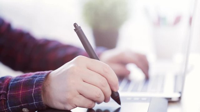 Artist Working with his graphic tablet