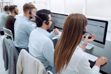 group of call center employees work with clients