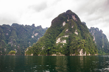 Beautiful landscape of mountain and lake while raining, the mountain was covered by low level rain...