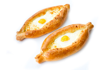 Traditional Georgian pastries. Adjarian khachapuri with egg isolated on white background.