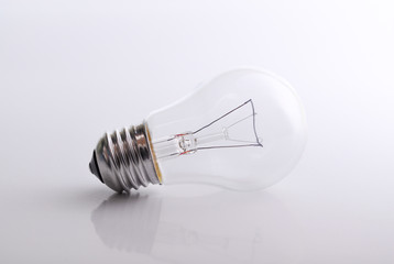 Light bulb on white / grey