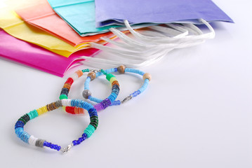 Colorful handmade bracelets and colorful packages.