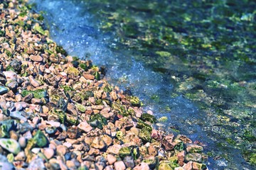 abstract stony texture closeup on an indistinct background of a sea surf for a natural landscape...