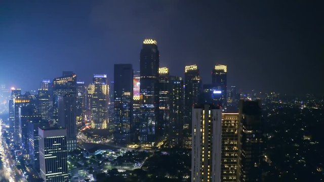 JAKARTA, Indonesia - October 10, 2018: Panoramic view of skyscrapers at night in Sudirman Central Business District at Jakarta, Indonesia. Shot in 4k resolution