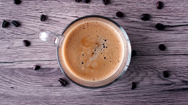 A cup of fresh coffee seen from above