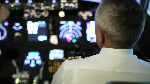 Captain is controls the airplane, rear view.