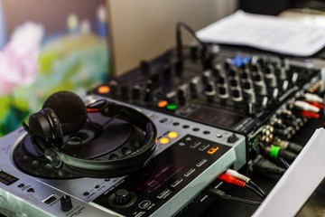 Fototapeta na wymiar Dj mixer with headphones, close-up