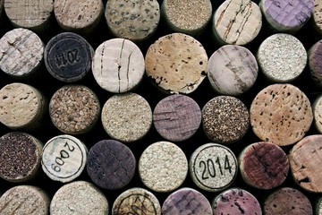 Background of used wine corks. Wall of many different wine corks. Closeup of wine corks.