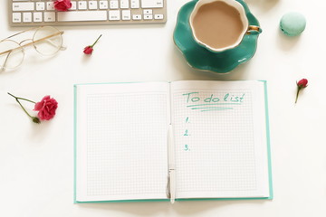 To do list concept.top view, flat lay women's office desk. Female workspace with laptop, flowers,...