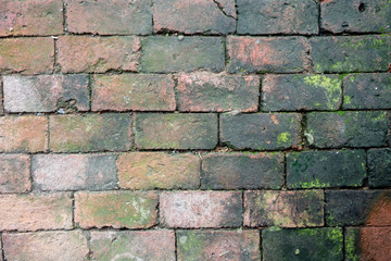 Close up on dirty orange brick wall for texture and background. Abstract pattern in horizontal.