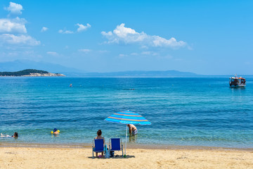 Fototapeta premium Olympiada, Greece - August 18, 2018: Beach of Olimpiada town at Chalkidiki, Greece