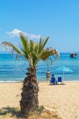 Fototapeta premium Olympiada, Greece - August 18, 2018: Beach of Olimpiada town at Chalkidiki, Greece
