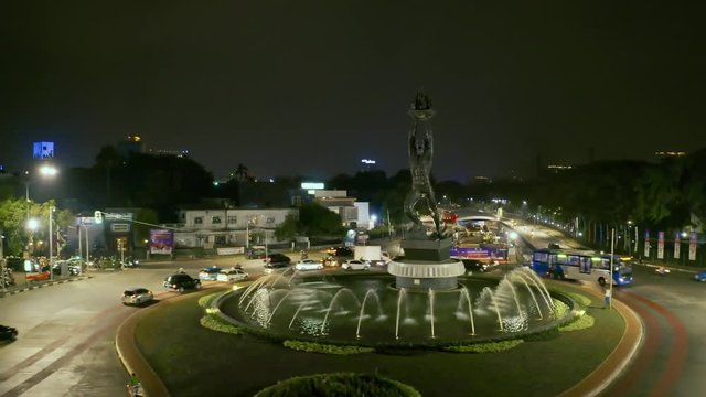 JAKARTA, Indonesia - October 10, 2018: Aerial view of Patung Pemuda Membangung or Youth Advancement Monument at night in Senayan Roundabout. Shot in 4k resolution