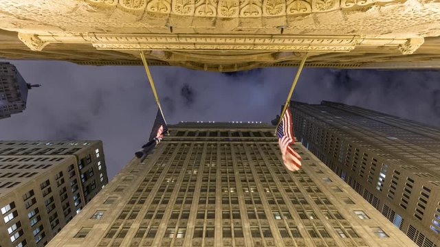 Night Timelapse of Chicago board of trade historic building, upward with US flag