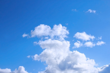 Naklejka na ściany i meble Clouds against blue sky. Blue sky and white clouds.