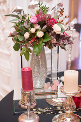 Flower table decorations for holidays and wedding dinner. Table set for holiday, event, party or wedding reception