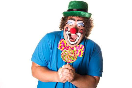 Funny clown. Fat man with candy. White background.