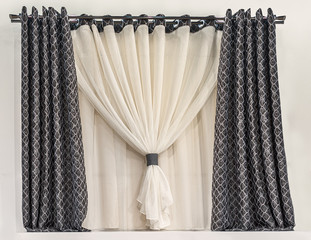 Design of a small window in a modern style. Combined curtain with eyelets. Black fabric with a...
