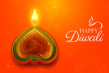 Burning diya on happy Diwali Holiday background for light festival of India