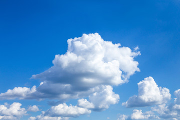 Obraz na płótnie Canvas Cloudscape. Blue sky with large white clouds. Beautiful big clouds slowly float against the blue sky.