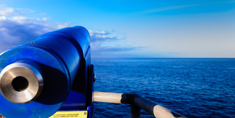 telescope observing the blue ocean