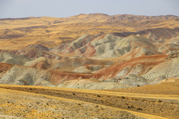 Fototapeta na wymiar The most beautiful colorful mountains similar to eastern spices in Tabriz, Iran