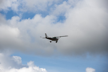 Fototapeta na wymiar A t6 vintage flight flying closeby at cherokee county airport
