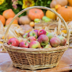 close up of red ripe apples in a basket at the farmer's market