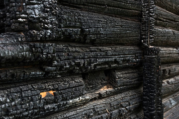 Wooden wall covered in ash
