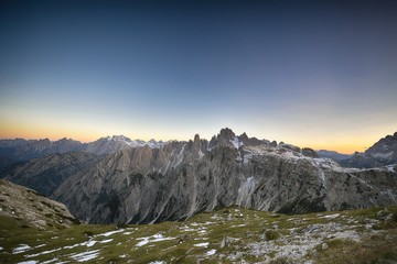 Panoramic view of famous Dolomites mountain peaks glowing in beautiful golden evening light at sunset in summer
