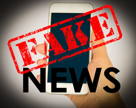 Fake news with young female hand holding smarhphone and white background. Conceptual image for social network.