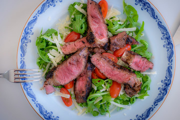 Beef with salad on a plate