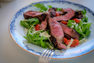 Beef with salad on a plate