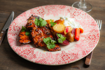 Grilled chicken with potatoes and salad
