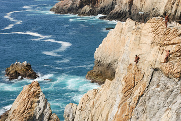 waiting to dive into the sea from the la quebrada cliffs of acapulco